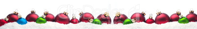 Colorful Christmas baubles in snow
