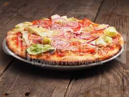 Crispy pizza on a rustic wooden table