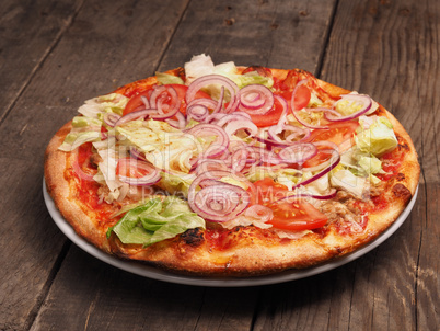 Crispy pizza on a rustic wooden table