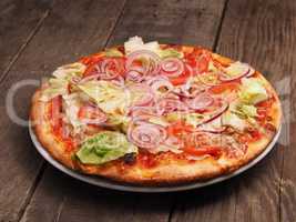 Crispy pizza on a rustic wooden table