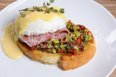 Toast with guacamole with egg Benedict