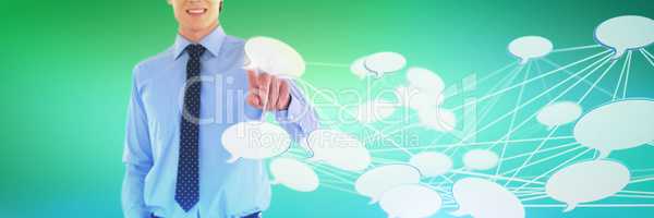 Composite image of mid section of smiling businessman using interface while standing with hand in po