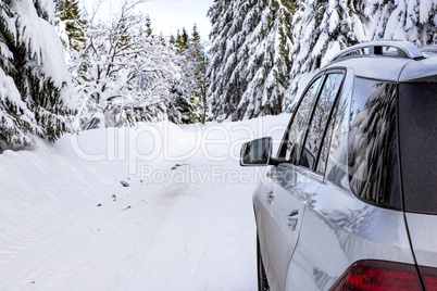 Car in snow-covered winter scenery