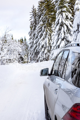 Car in snow-covered winter scenery