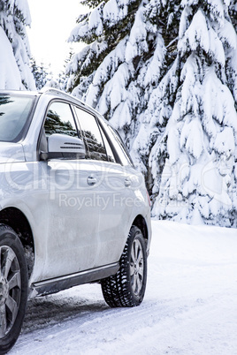 Car in snow-covered winter scenery