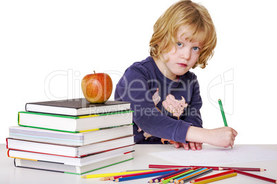 Girl with a stack of books and crayons