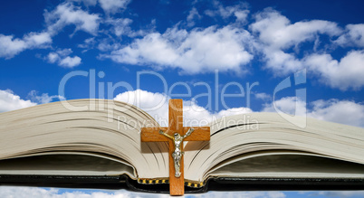 Open book and a cross