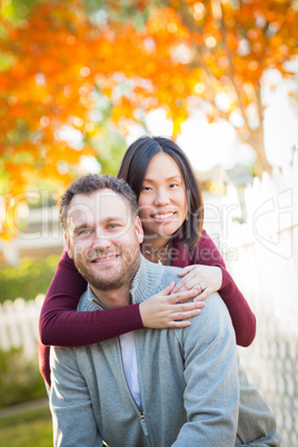 Outdoor Fall Portrait of Chinese and Caucasian Young Adult Coupl