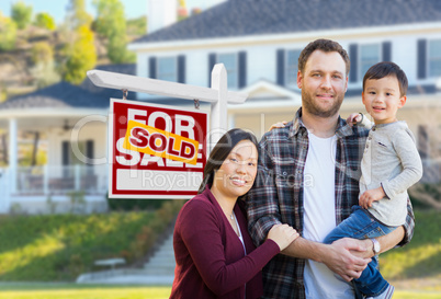 Mixed Race Chinese and Caucasian Parents and Child In Front of H