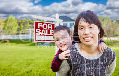 Chinese Mother and Mixed Race Child In Front of Custom House and