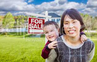 Chinese Mother and Mixed Race Child In Front of Custom House and