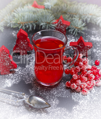 tea made from fresh berries of viburnum in a glass cup