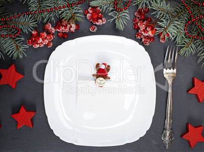 empty white square plate and fork