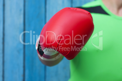 human hand in a red boxing glove