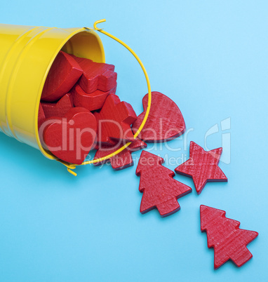 iron yellow bucket with red wooden figures