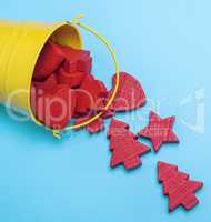 iron yellow bucket with red wooden figures