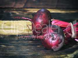 fresh red beet on a brown table