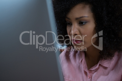 Woman using computer at home