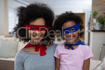 Mother and daughter pretending to be superhero