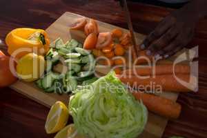 Woman chopping vegetables in kitchen