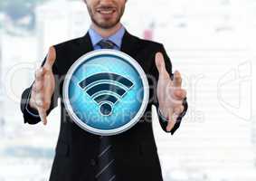 Wi-Fi icon and Businessman with hands palm open in city
