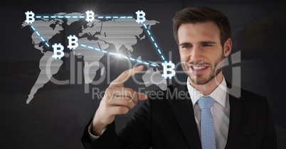 Businessman touching bitcoin graphic icons on world map connecting