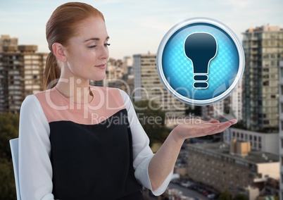 Light bulb icon and Businessman with hand palm open in city