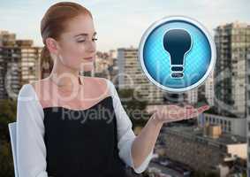 Light bulb icon and Businessman with hand palm open in city