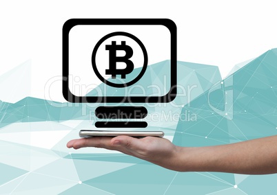 Bitcoin computer icon and hand holding phone