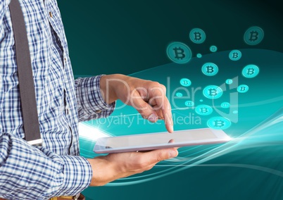 Bitcoin icons and man holding tablet