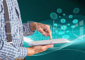 Bitcoin icons and man holding tablet
