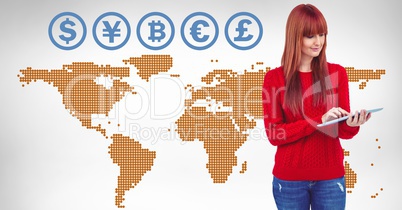 Currency icons on world map with woman on tablet