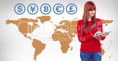 Currency icons on world map with woman on tablet