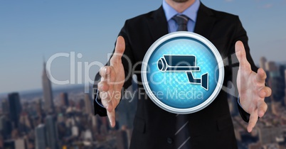 Security camera icon and Businessman with hands palm open in city