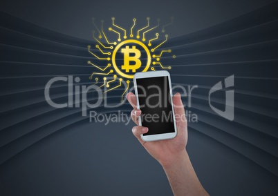 Bitcoin icon and hand holding phone