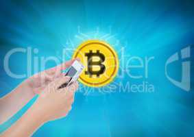 Bitcoin icon and hands holding phone