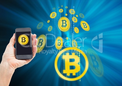 Bitcoin icons and hand holding phone