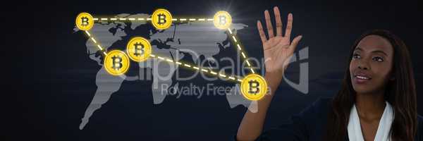 Businesswoman touching bitcoin graphic icon on world map