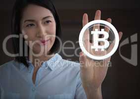 Businesswoman touching bitcoin graphic icon