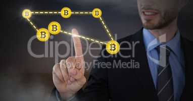 Businessman touching bitcoin graphic icons connecting