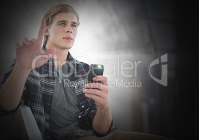 Businessman touching air glow holding phone