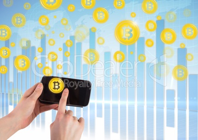 Bitcoin icons and bar charts with hand holding phone