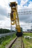 railway crane standing on the tracks