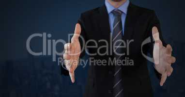 Businessman with hands palm open and dark background