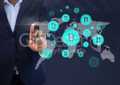 Businessman touching bitcoin graphic icons on world map