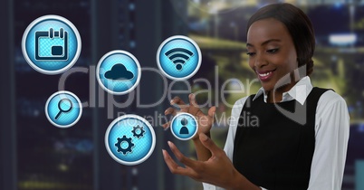 Various business app icons and Businesswoman with hands palm open in city office at night
