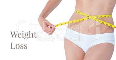 Weight loss text and woman measuring waist