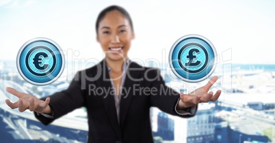 Euro and pound icons and Businesswoman with hands palm open in city