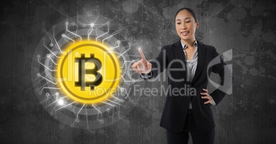 Businesswoman touching bitcoin graphic icon