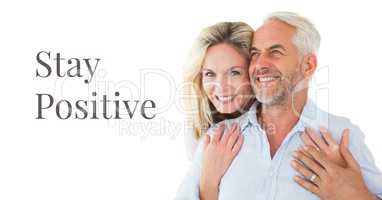 Stay positive text and happy older couple